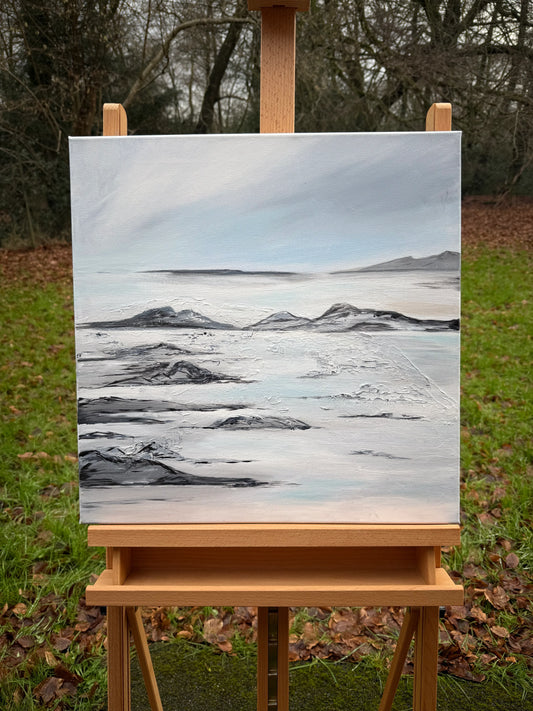 Romantic landscape oil painting of a tranquil lagoon with soft sky and rocky shoreline on canvas.